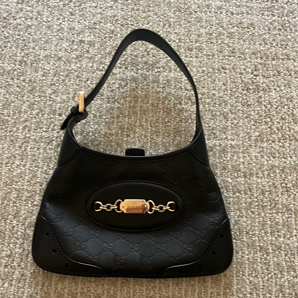 Authentic vintage Gucci purse comes in original bag.